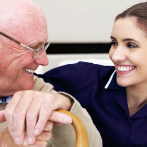 senior man sitting with clinical health professional